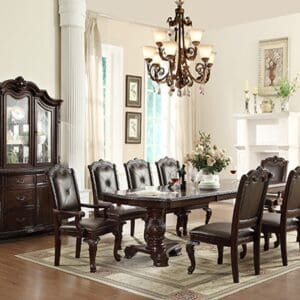 A dining room table and chairs in the center of a room.