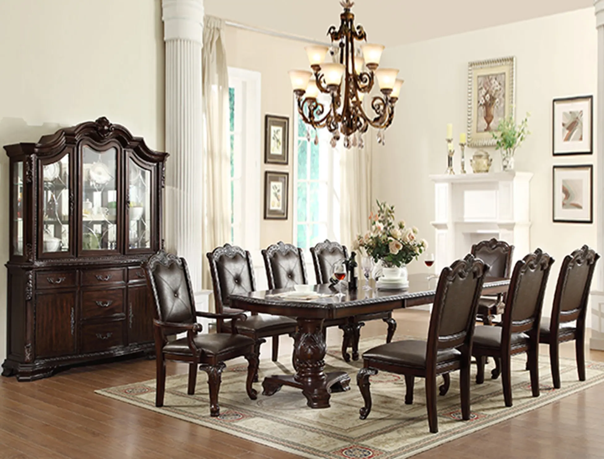 A dining room table and chairs in the center of a room.