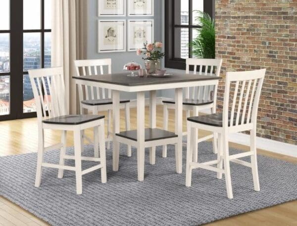 A dining room table with chairs and a rug.