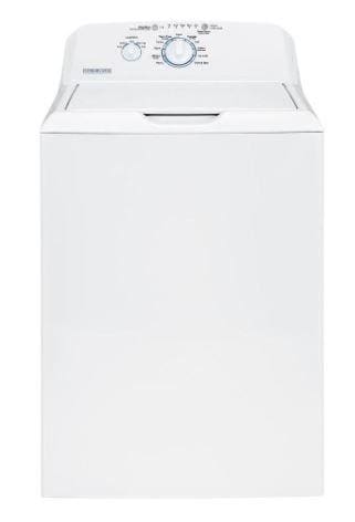 A white washer sitting on top of a wooden table.