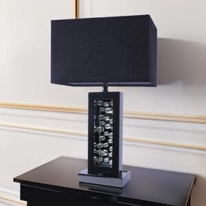 A table lamp on top of a black table.