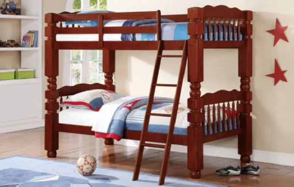 A bunk bed with ladder and ball on the bottom.