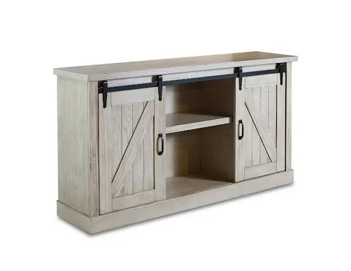 A white entertainment center with sliding barn doors.